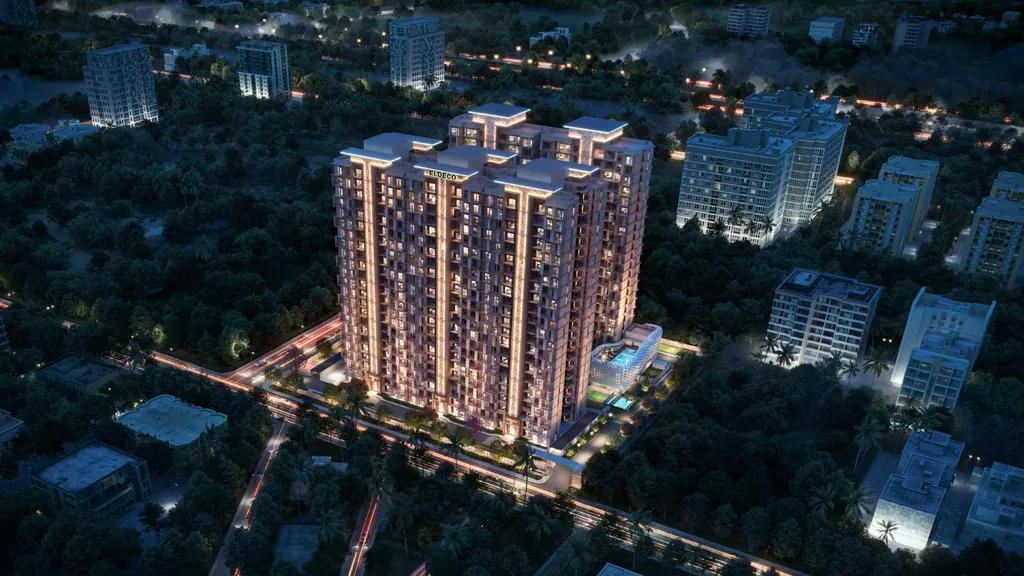 Night aerial view of the five lit Eldeco La Vida Bella towers — artistic render from the developer's brochure